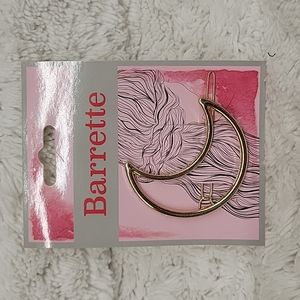 Pretty gold half moon barrette.